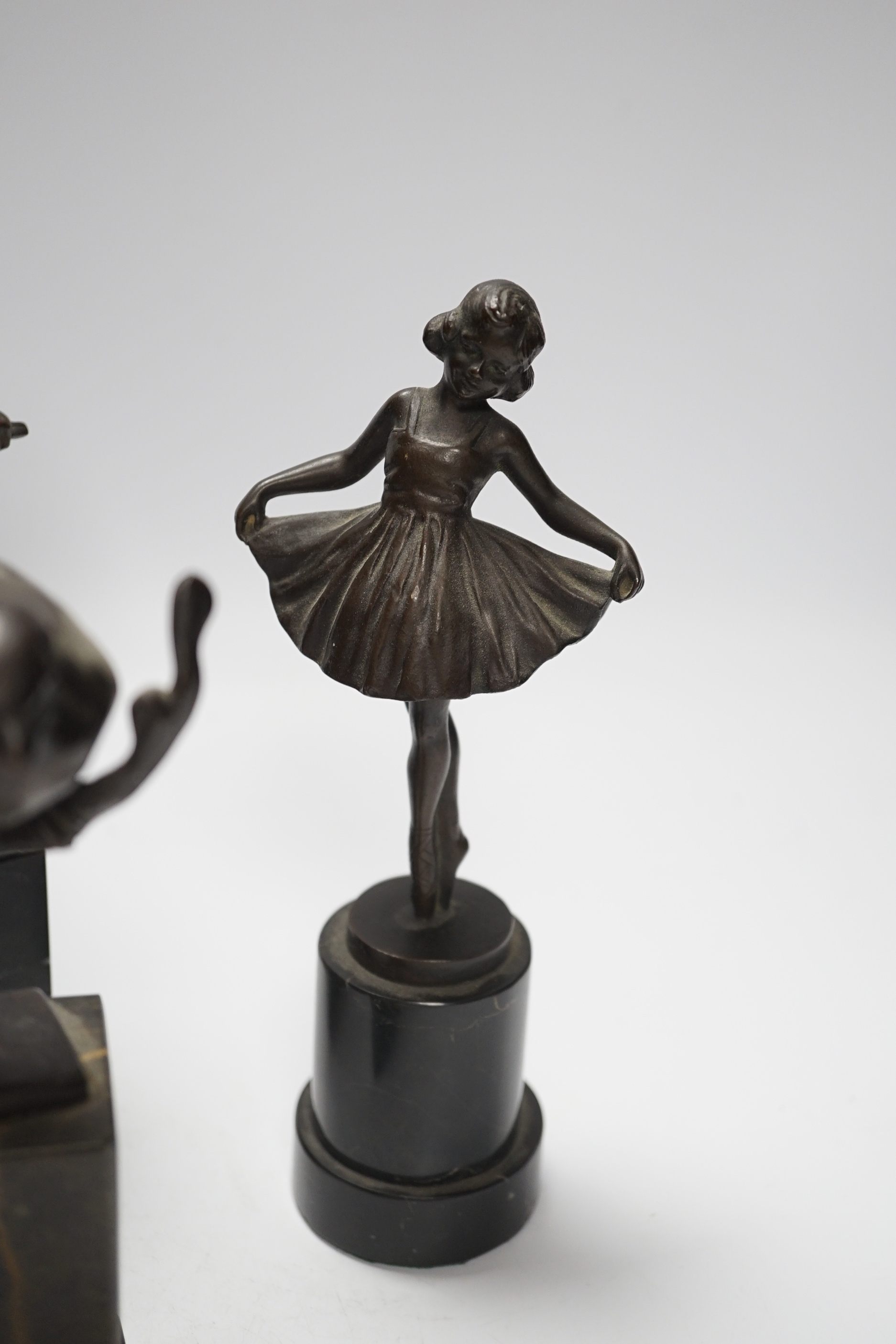 A German bronze of a blacksmith, indistinctly signed, a bronze figure group signed Öbold, a bronze of a Robin, signed K. Reynen and an unsigned bronze of a ballerina, all on marble bases, tallest 27cm (4)